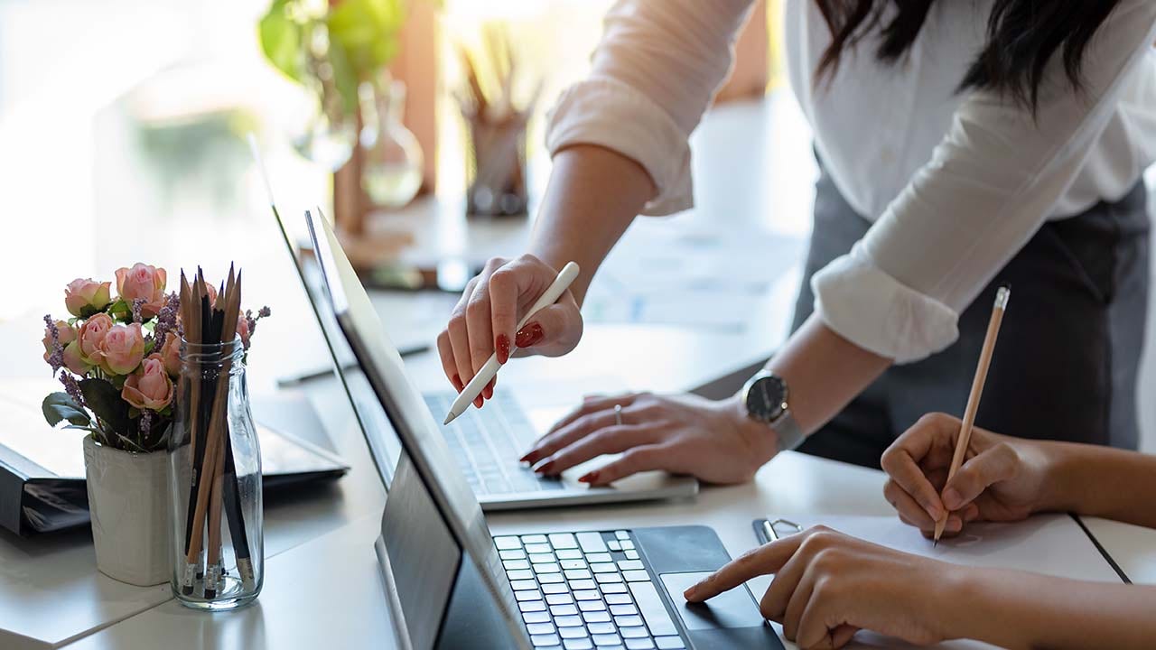 Business people working pointing laptop.