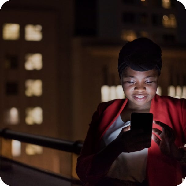 Woman looking at her banking app on her mobile phone.