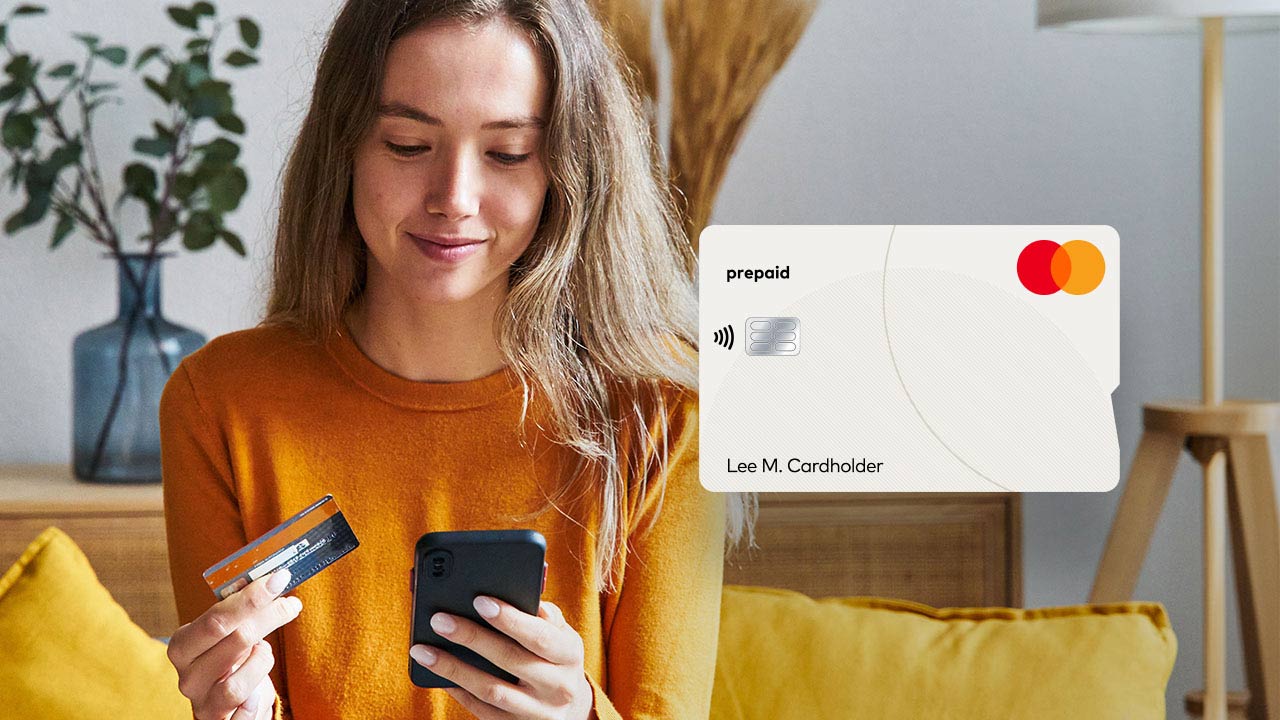 Woman shopping online with prepaid card.