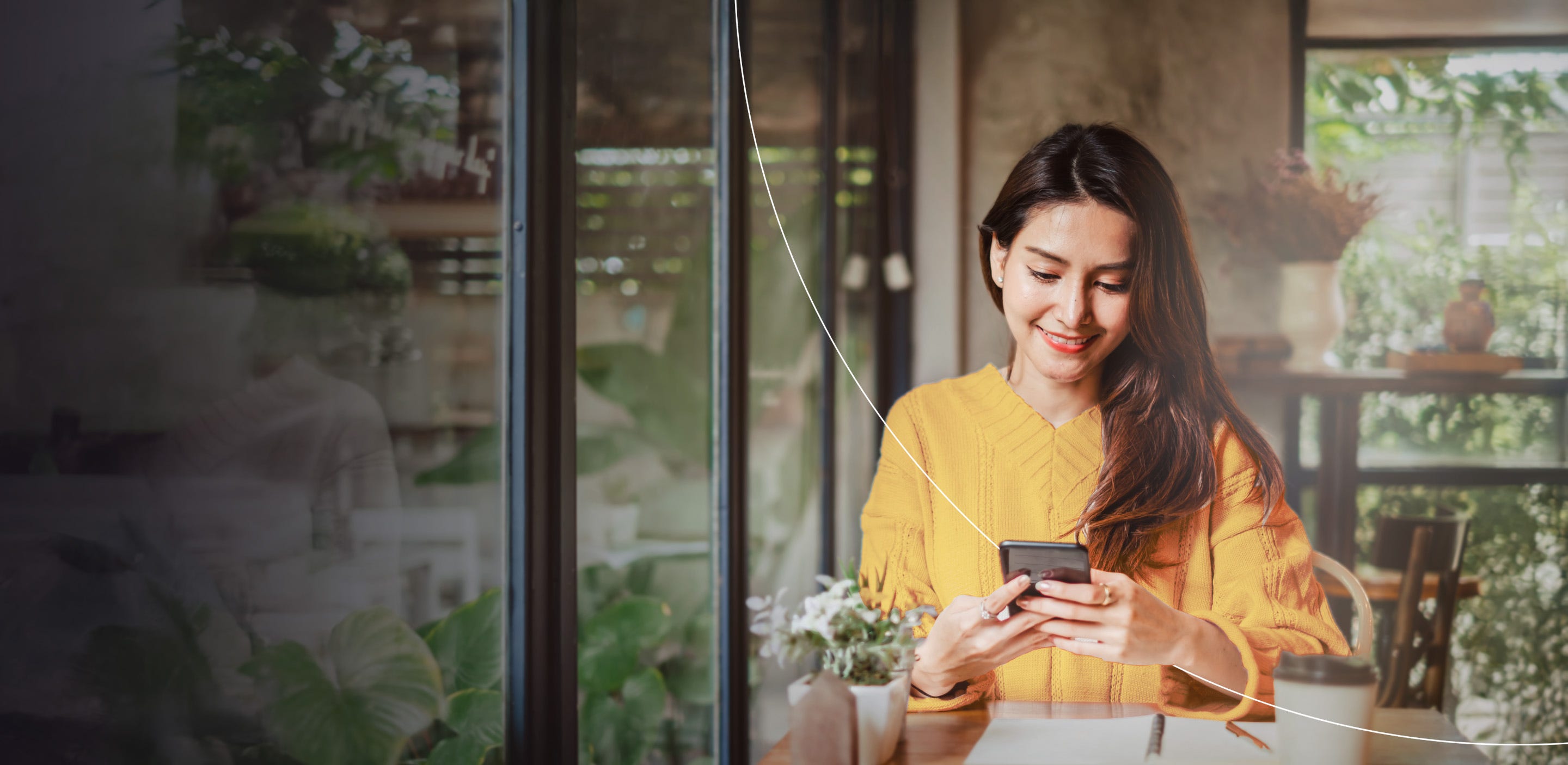 Woman smiling while scrolling her phone
