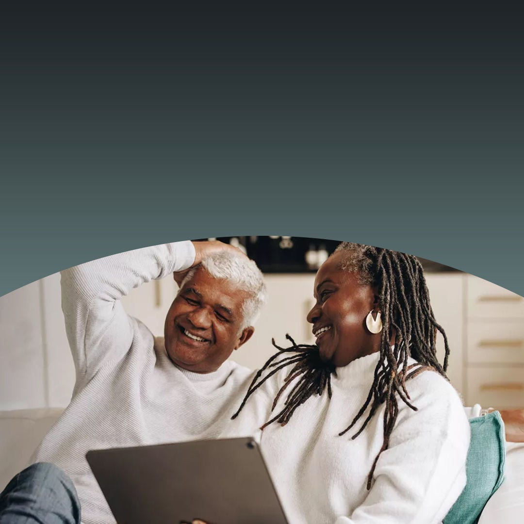 Couple looking at each other and laughing.